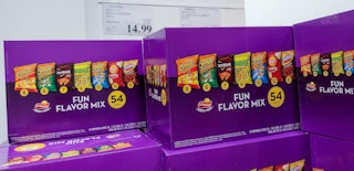 boxes of chips stacked up with sales sign at costco