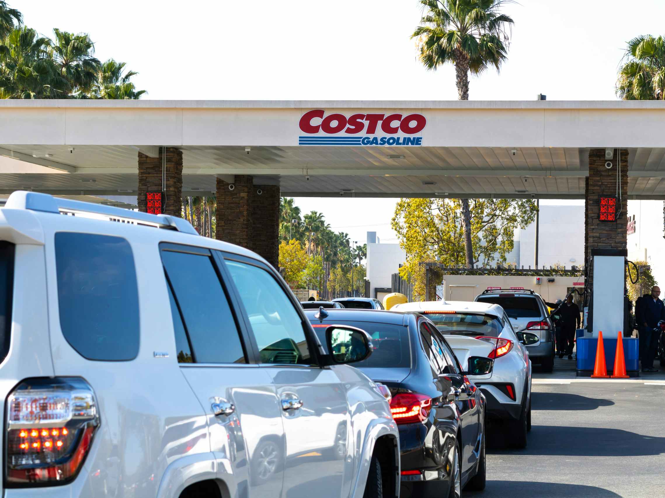 A line of cars leading to the Costco gas station pumps.