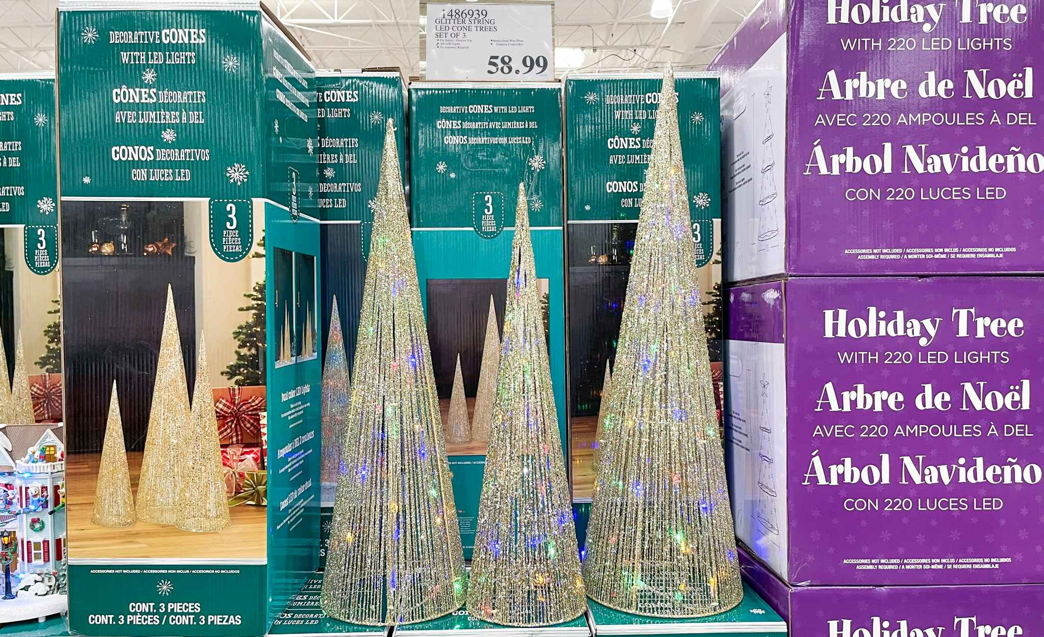 holiday cone tree set of 3 on display with sale sign at costco