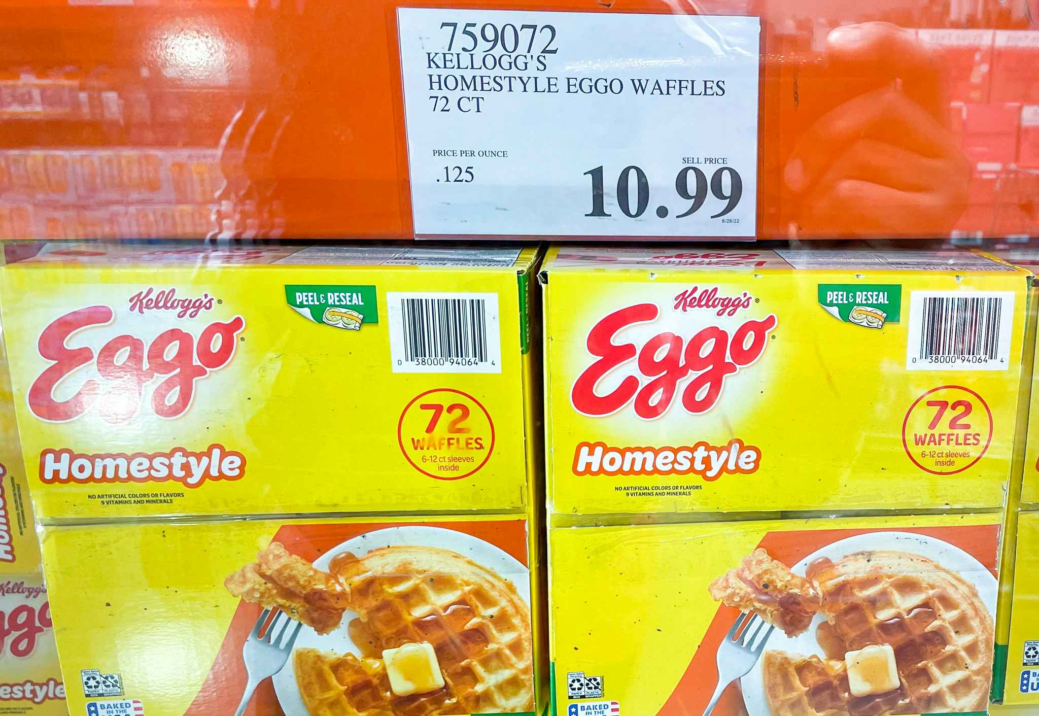 eggo waffles in boxes in a freezer with sale sign at costco
