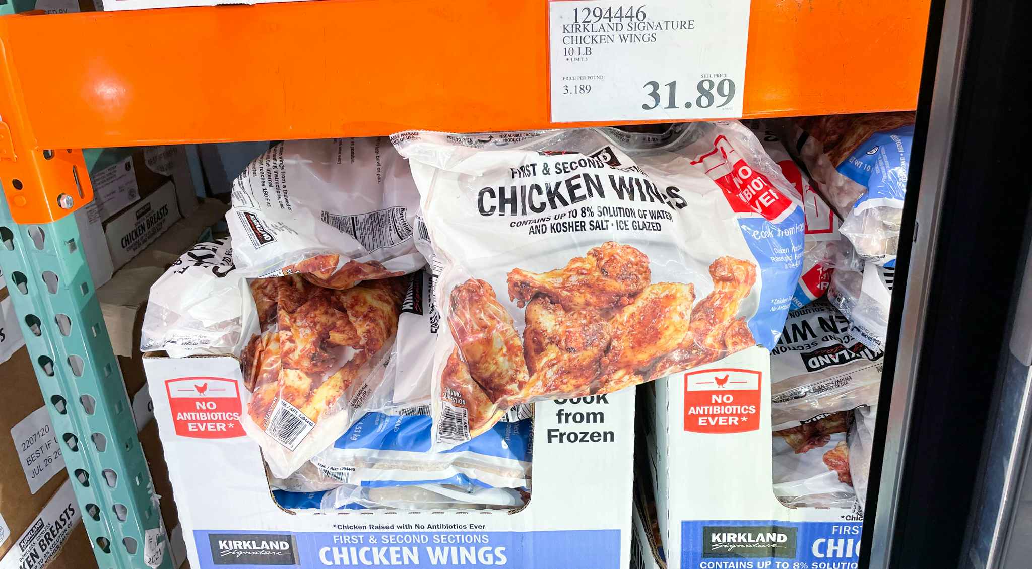 chicken wings in a freezer with sale sign at costco