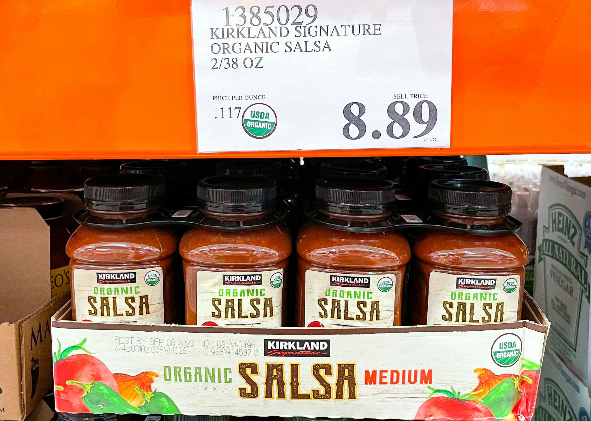salsa on a shelf with sale sign at costco