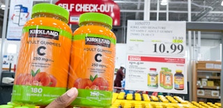 vitamin c hand held near sale sign at costco