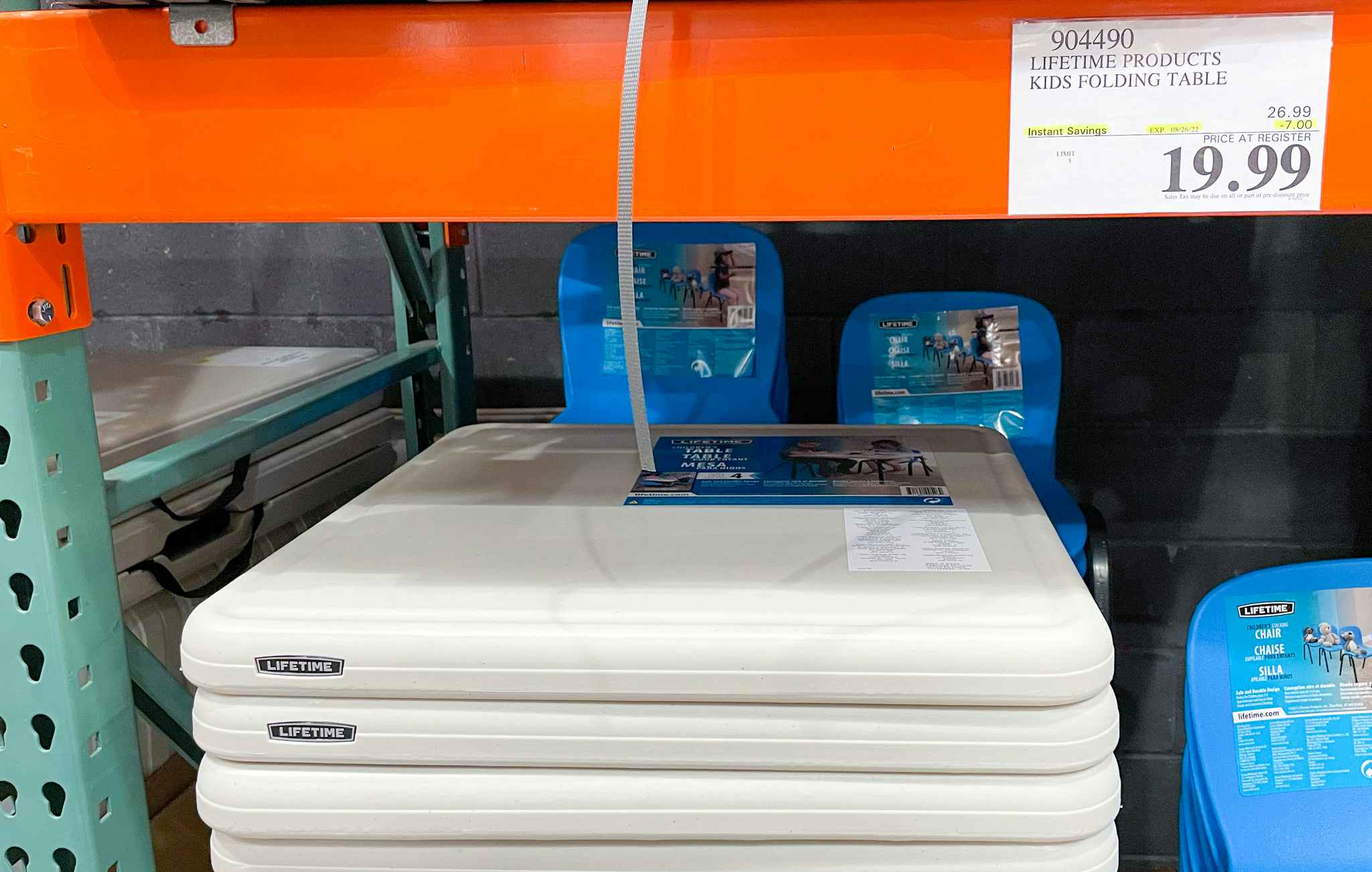 table on a shelf with sale sign at costco