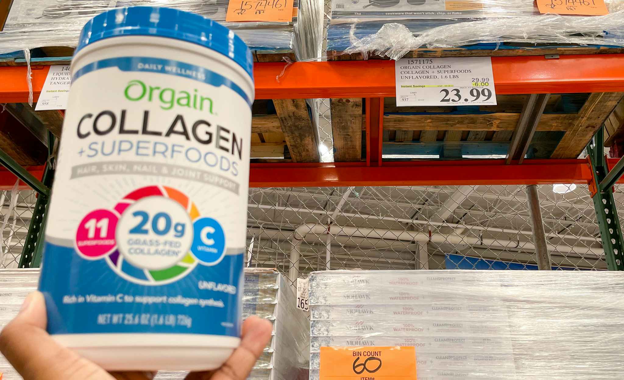 orgain collagen superfoods hand held near sale sign at costco