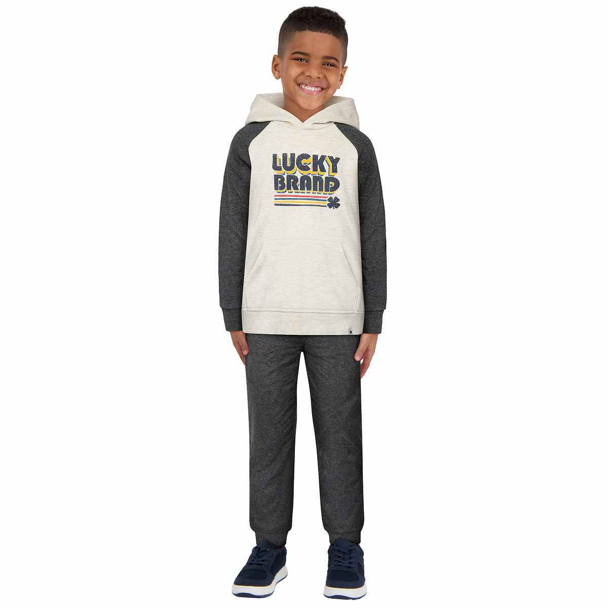 child wearing a 2 piece lucky brand set with black pants and a hoodie