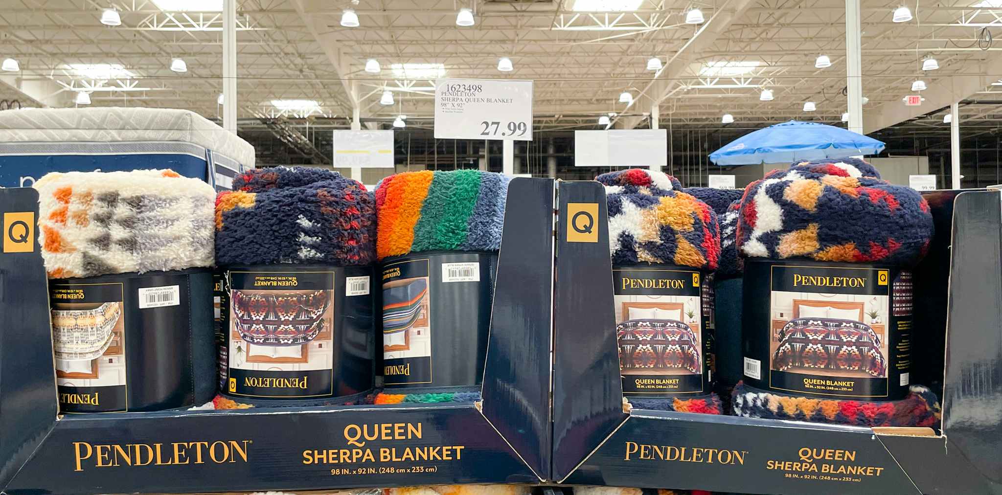 blankets in a display box with sale sign at costco