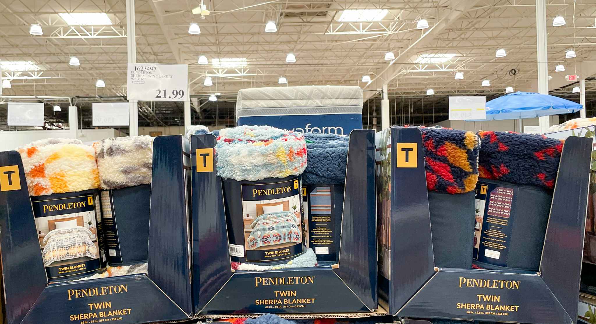 blankets in a display box with sale sign at costco