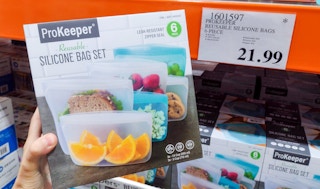 storage bags in a box hand held near sales sign