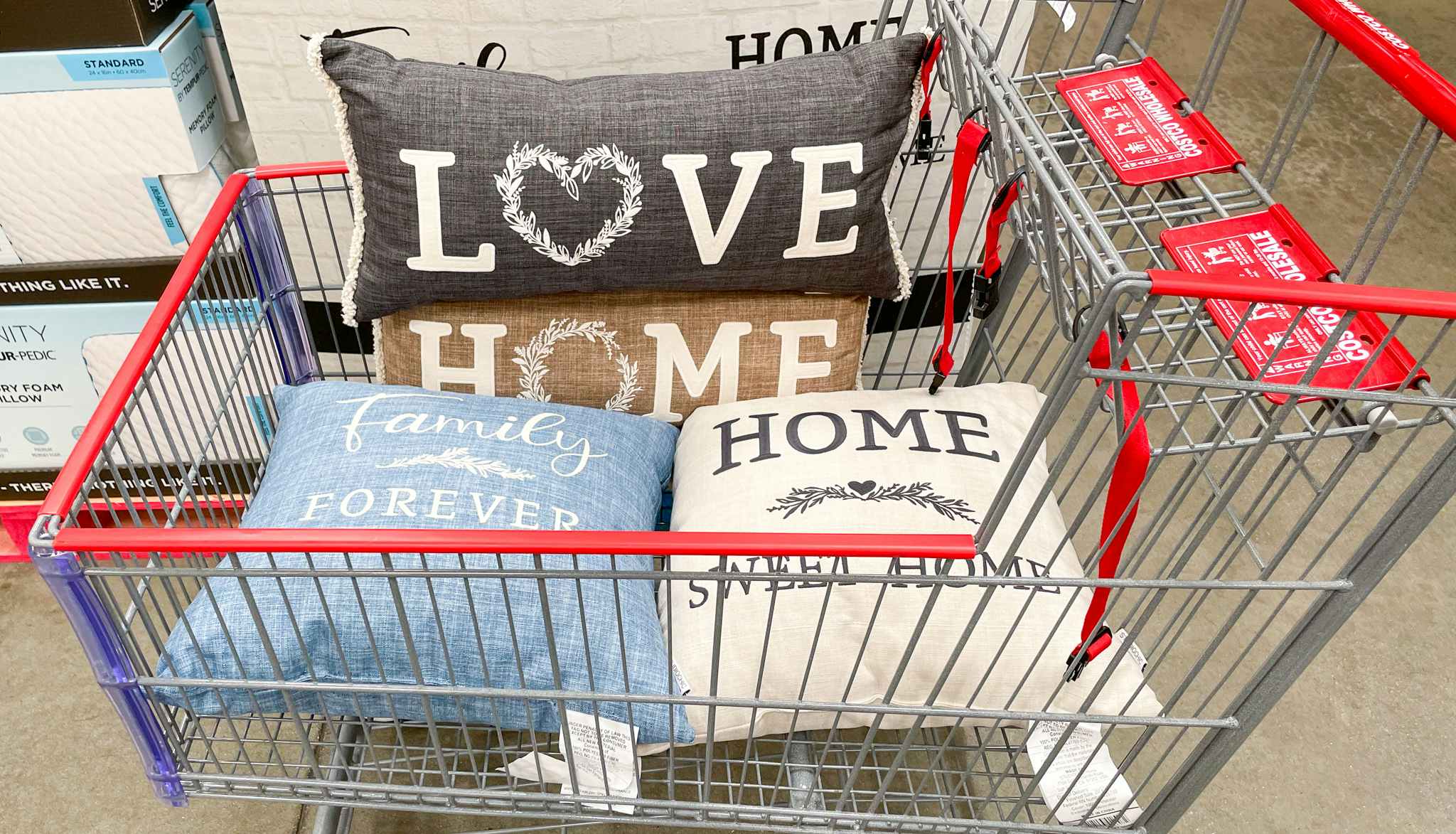 decorative pillows in a cart at costco