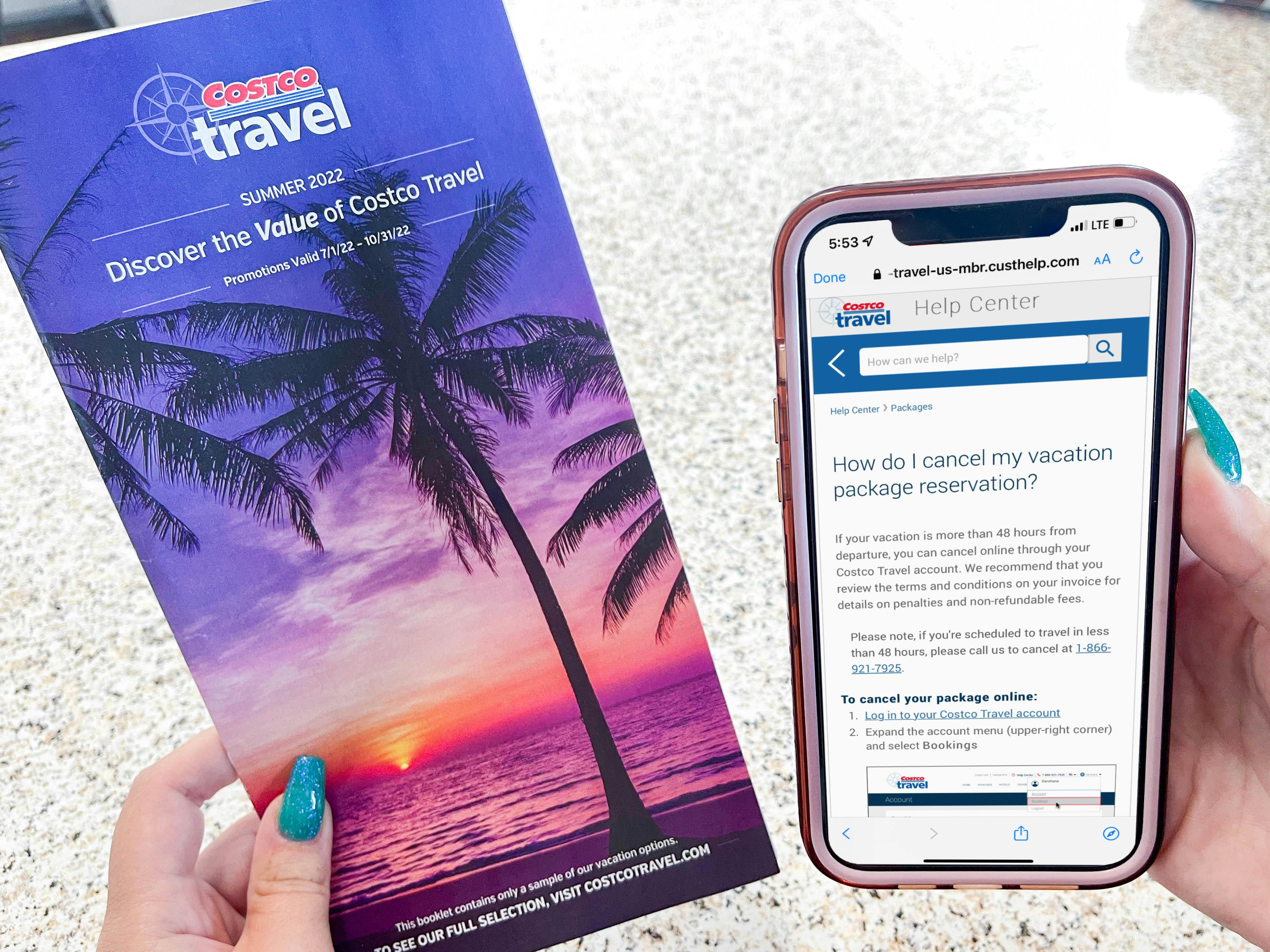 a person holding a costco travel brochure and cellphone with travel app on screen