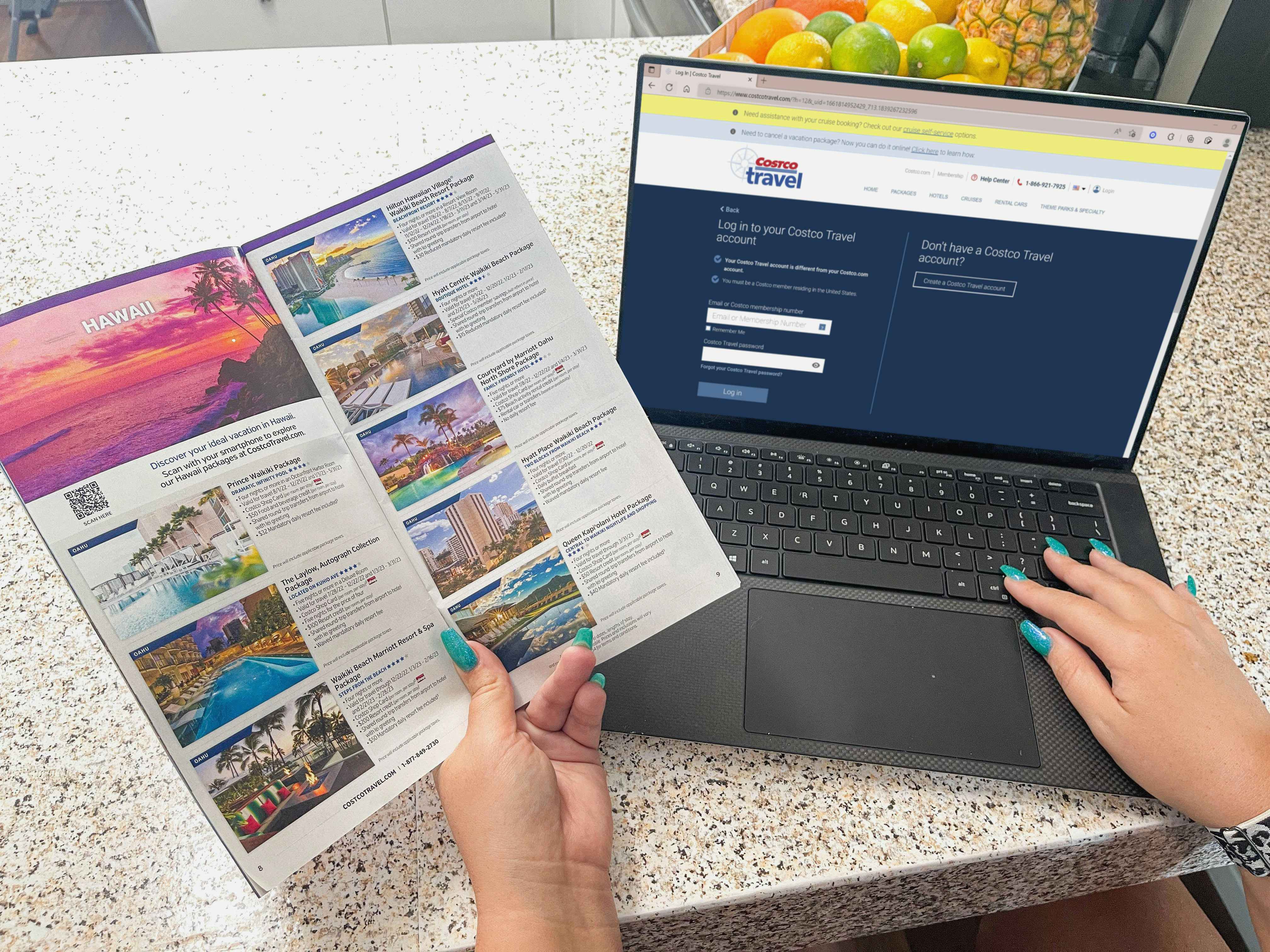 a person looking at costco travel brochure while on the costco travel website on laptop 