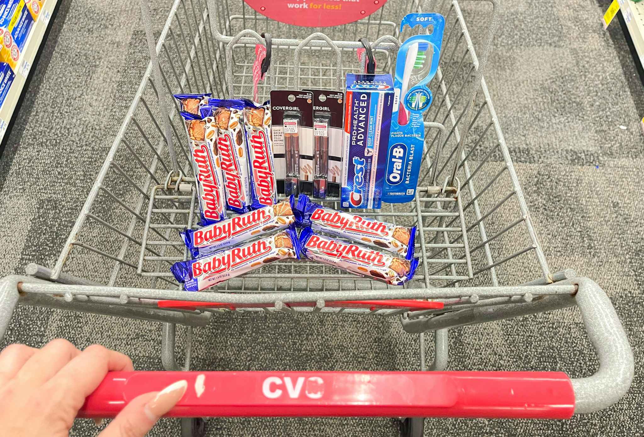 baby ruth, covergirl, crest, and oral-b in cvs shopping cart