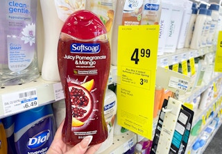 softsoap body wash held next to extrabucks sale tag