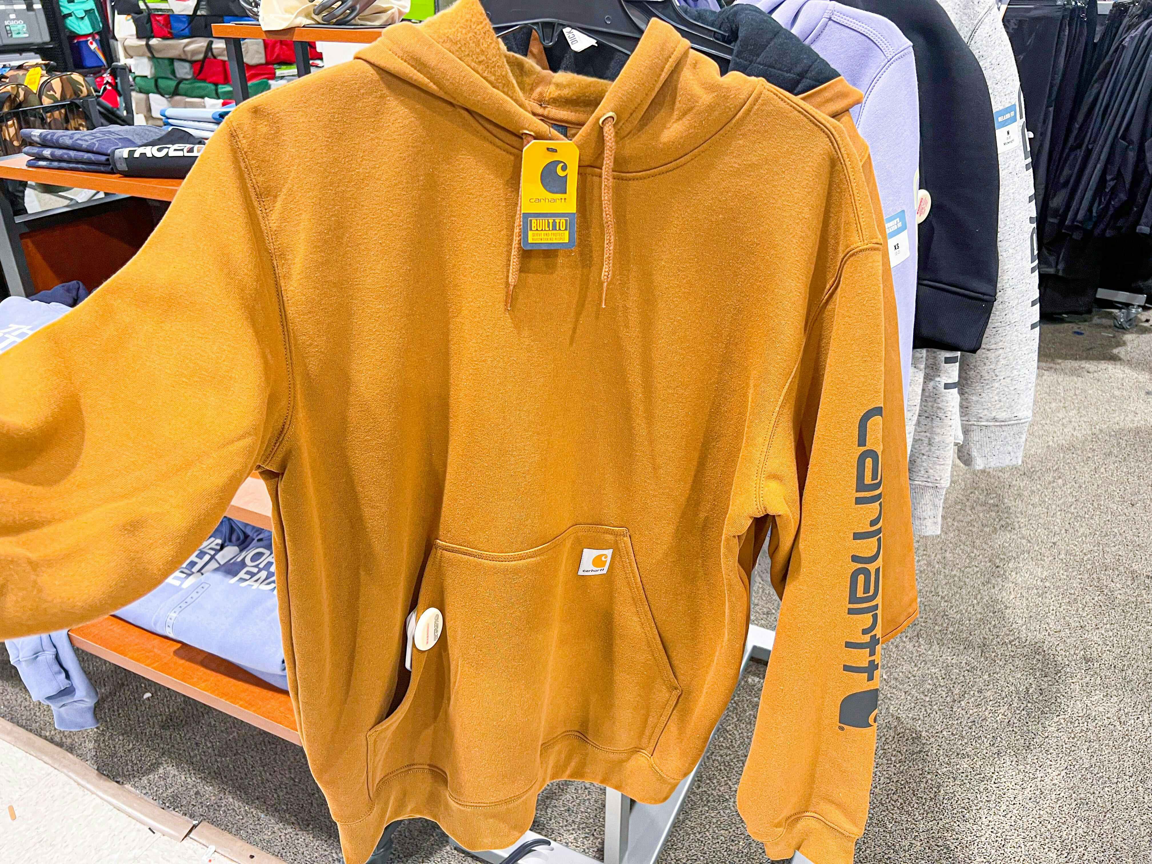 Yellow Carhartt Hoodie on rack