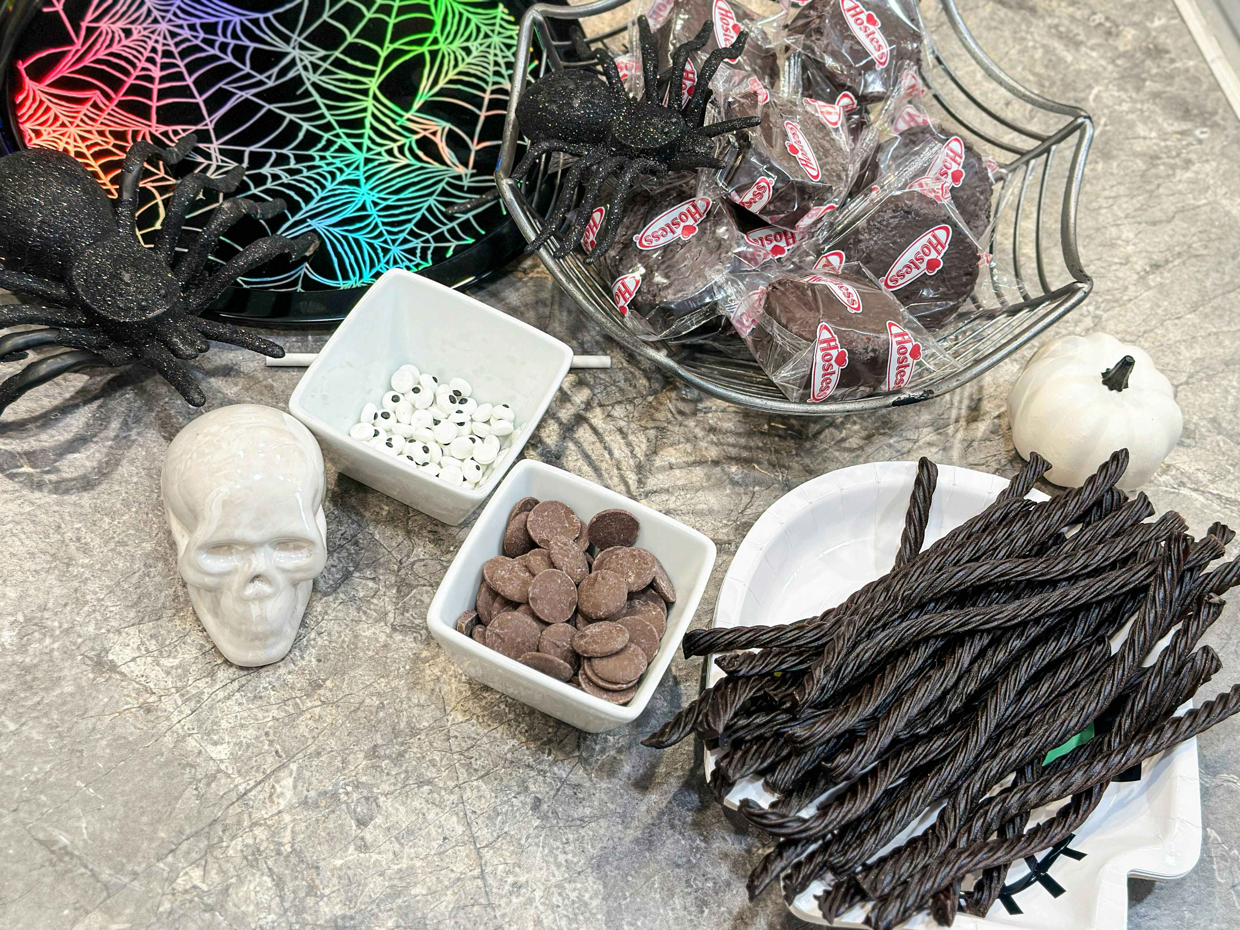 supplies on a counter to make diy spider cakes 