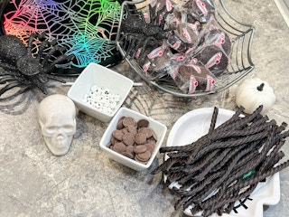 supplies on a counter to make diy spider cakes