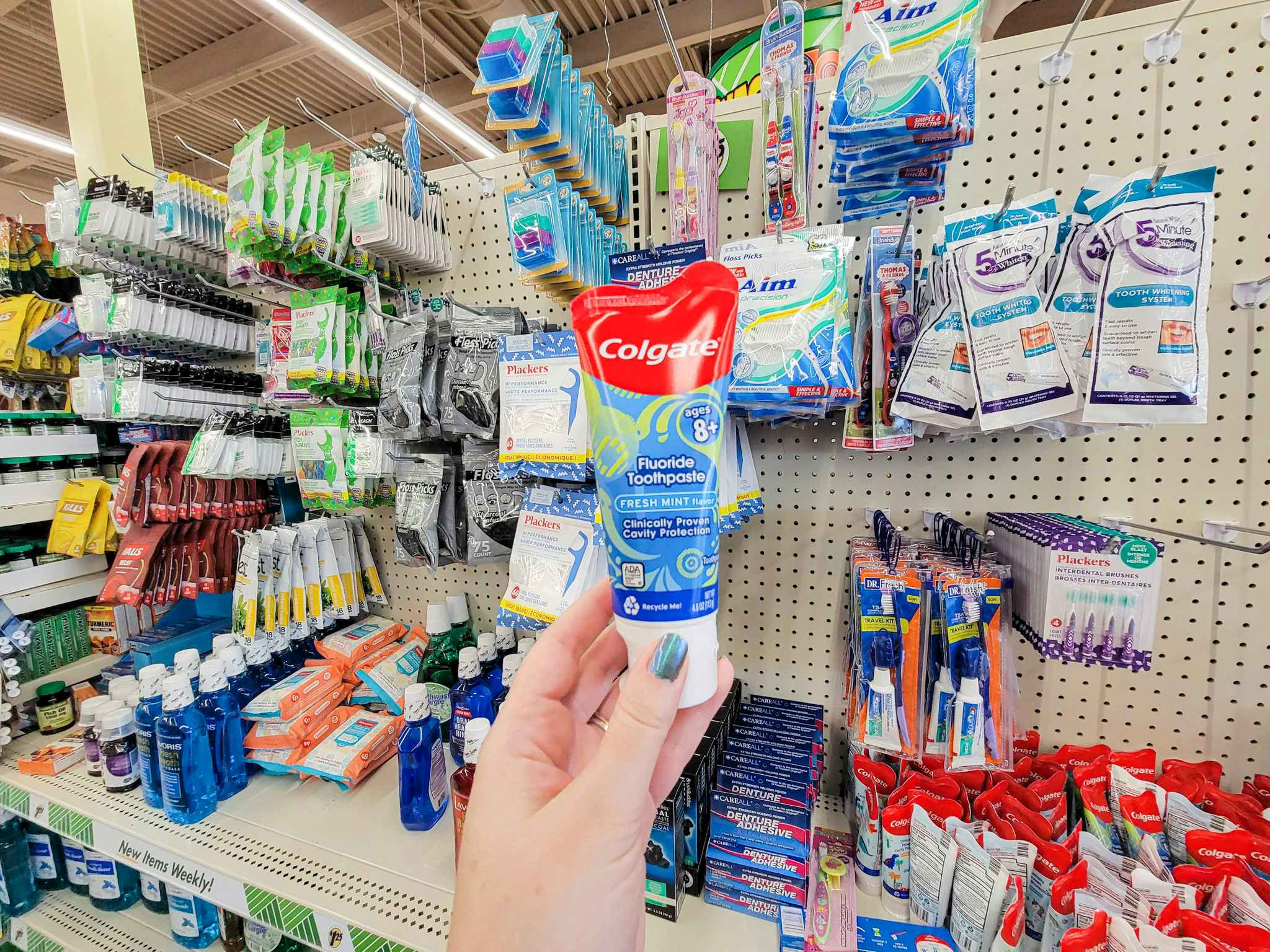 hand holding a kids colgate toothpaste