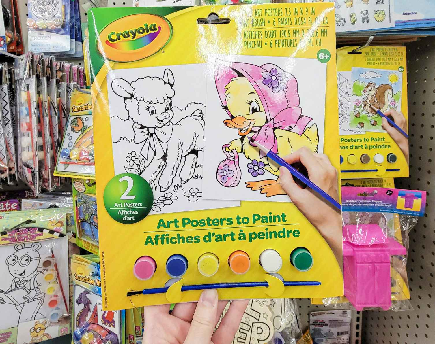 hand holding up a crayola kids poster painting kit