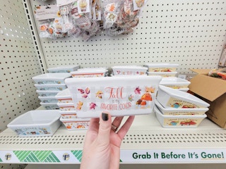 hand holding a mini loaf pan that says fall is my favorite color