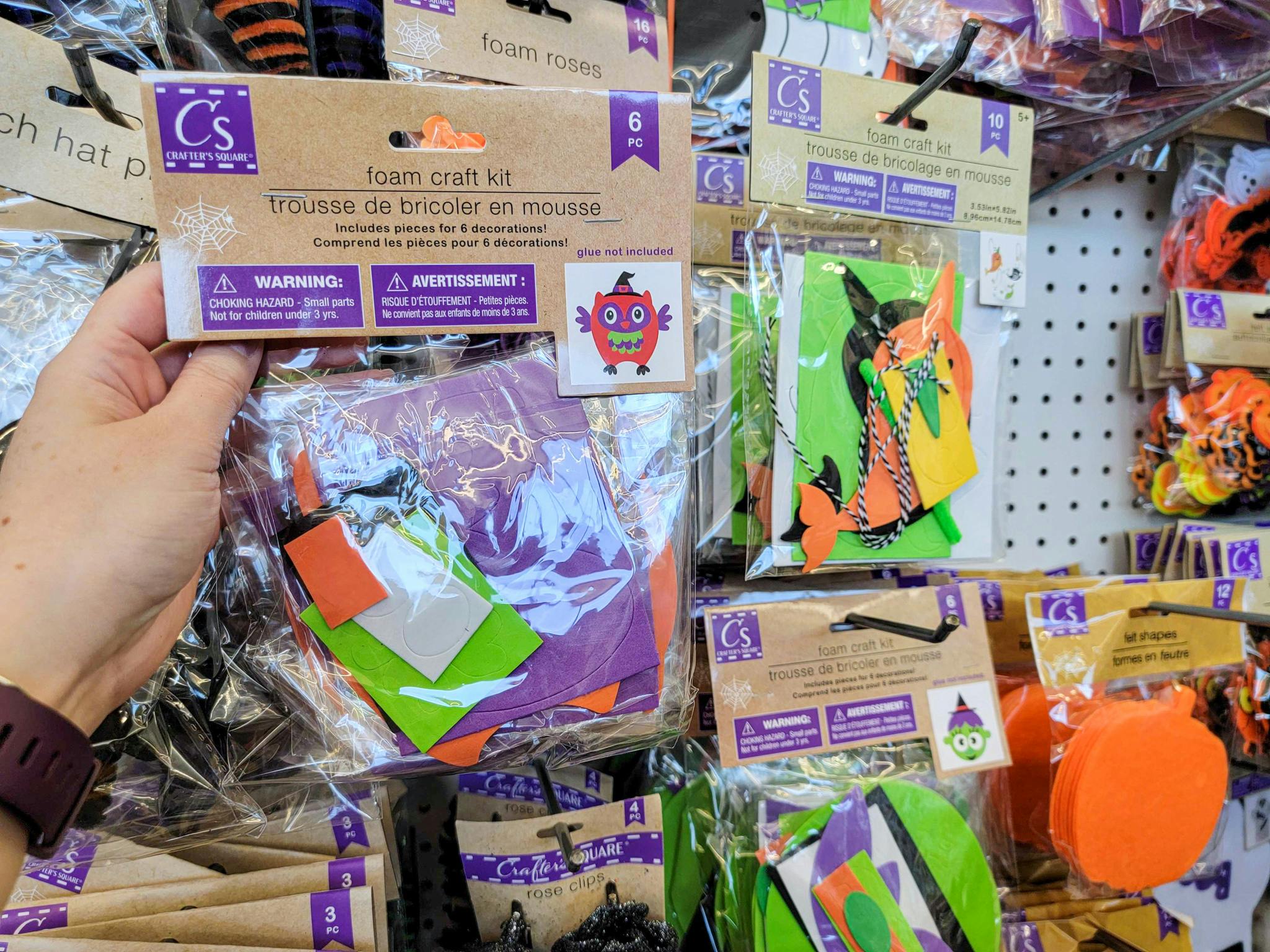 hand holding a halloween felt craft kit by others