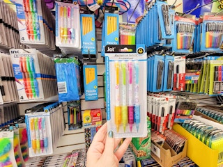 hand holding a package of mechanical pencils