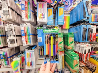 hand holding a pack of mechanical pencils