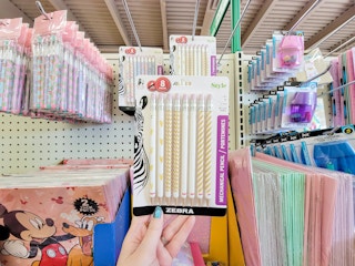 hand holding a pack of zebra mechanical pencils