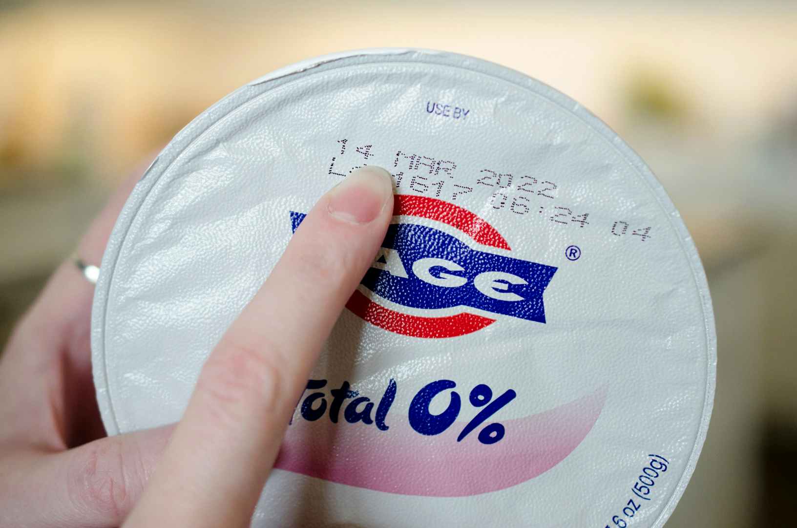 Fage Total greek yogurt expiration date finger pointing
