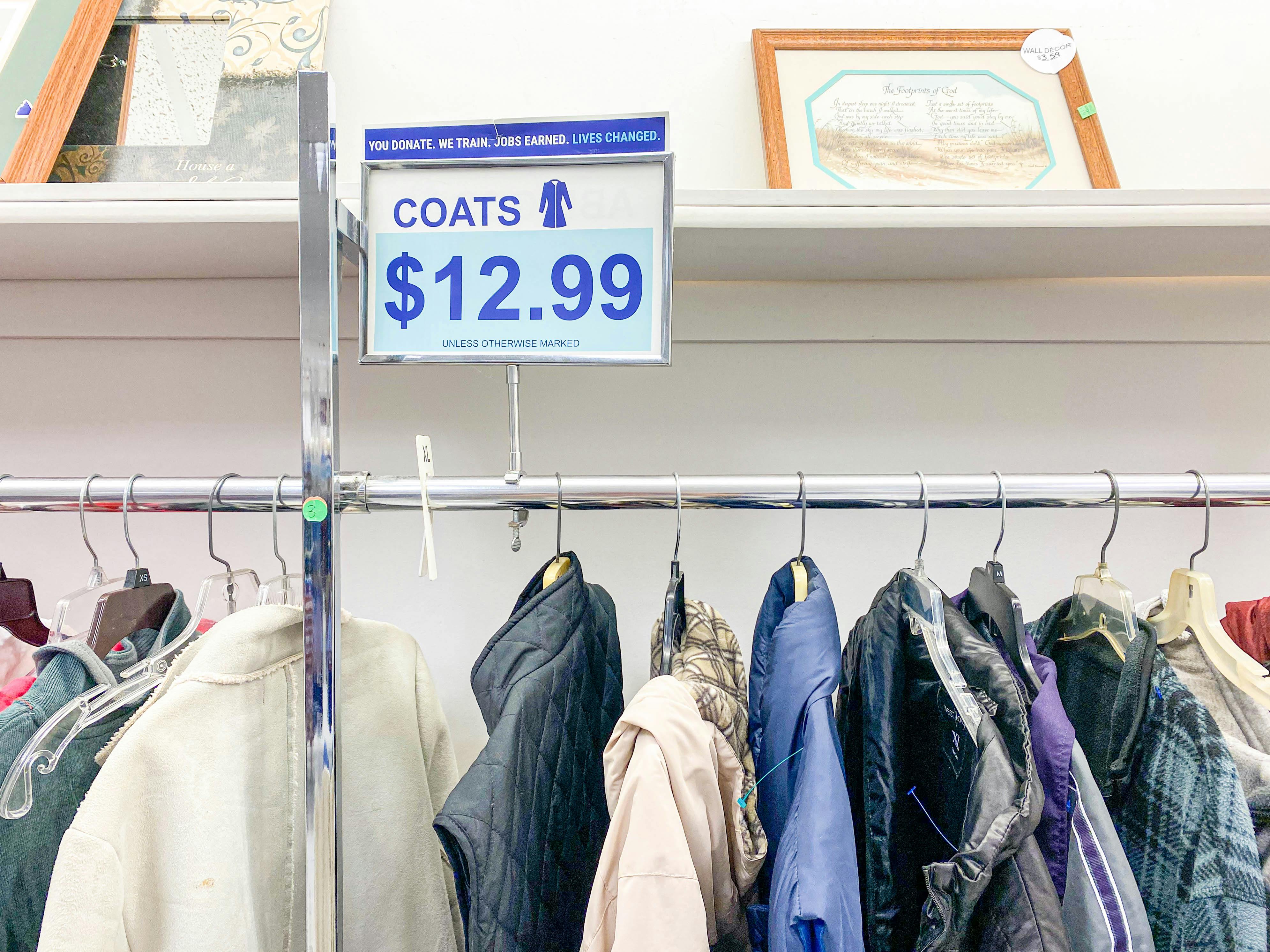 coat rack and price sign in goodwill
