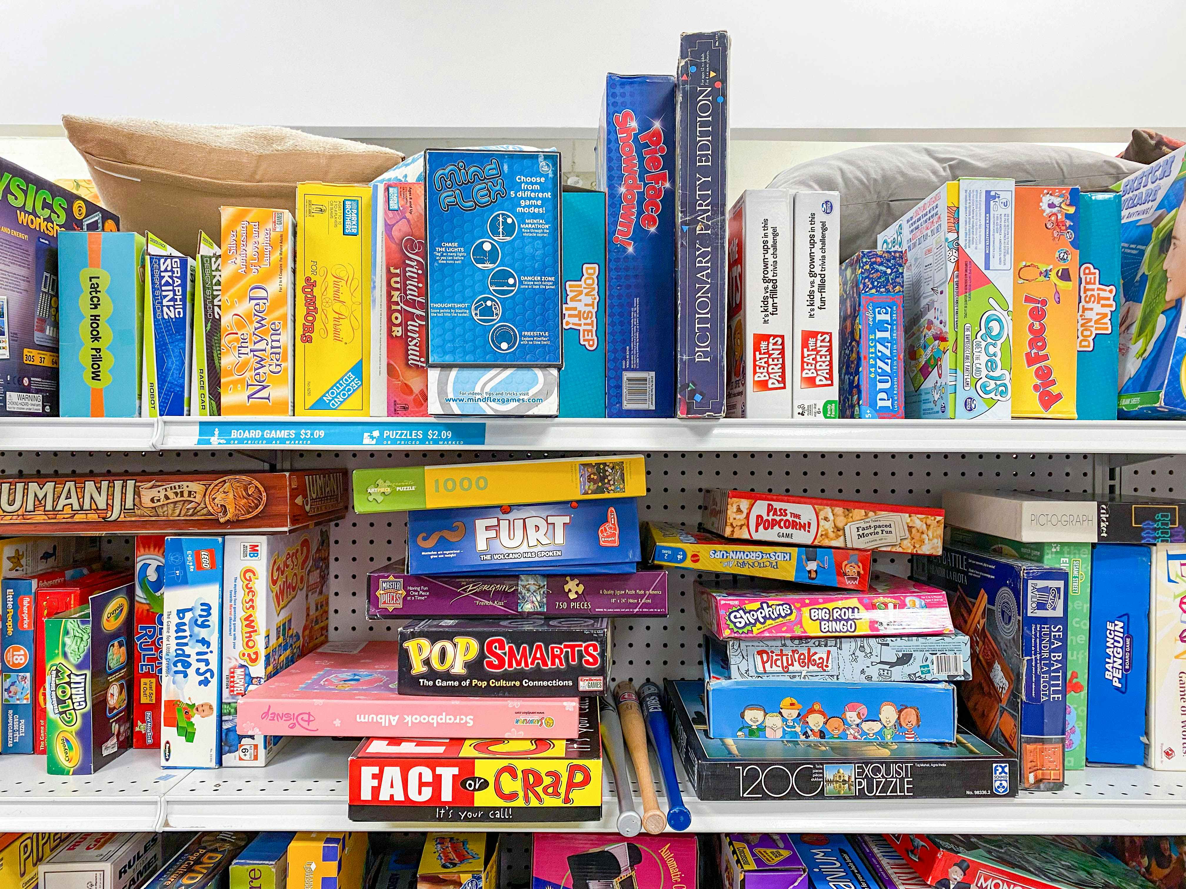 goodwill shelves with thrift store puzzles and games