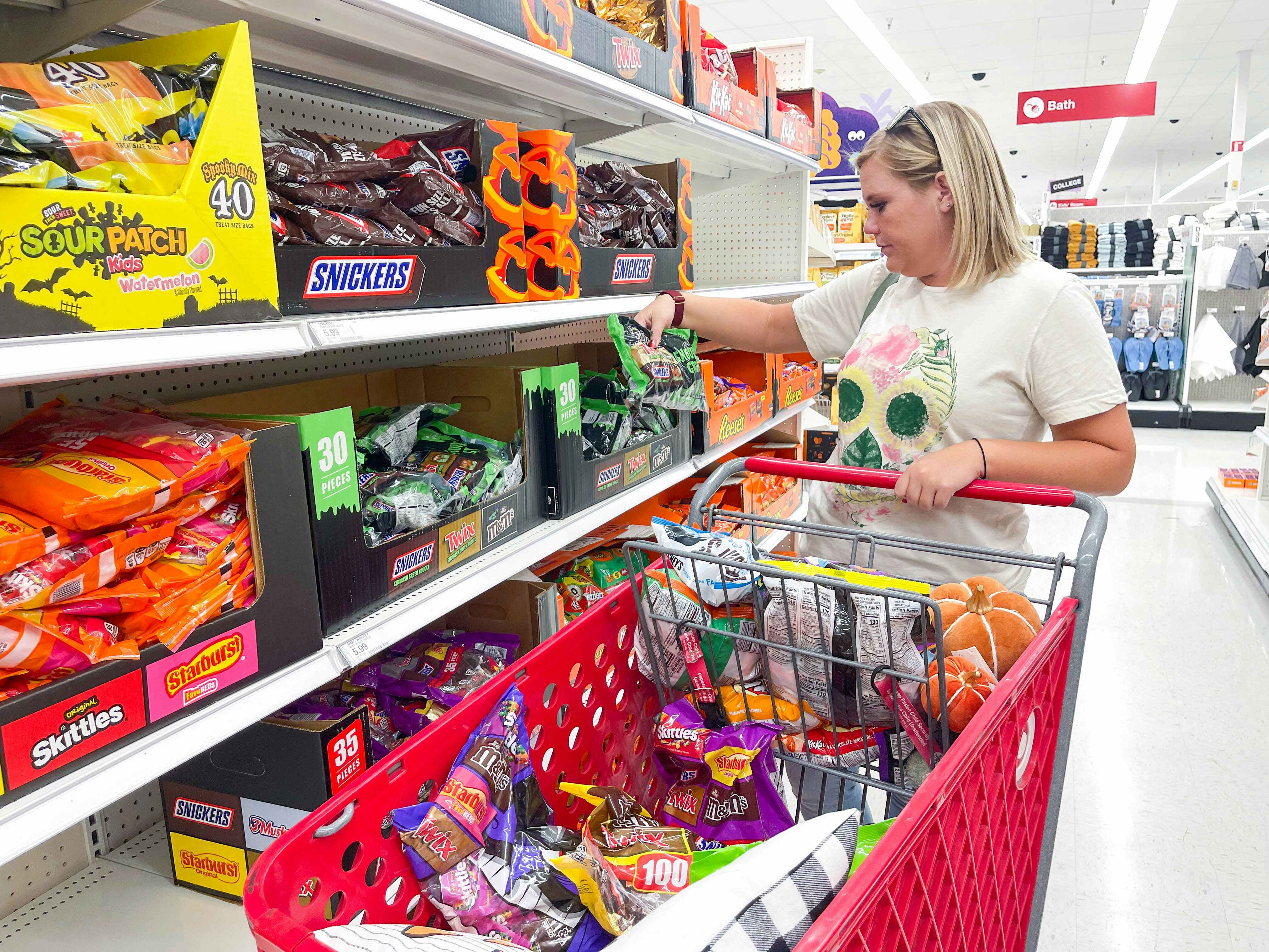 A woman looking at Halloween candy at Target.