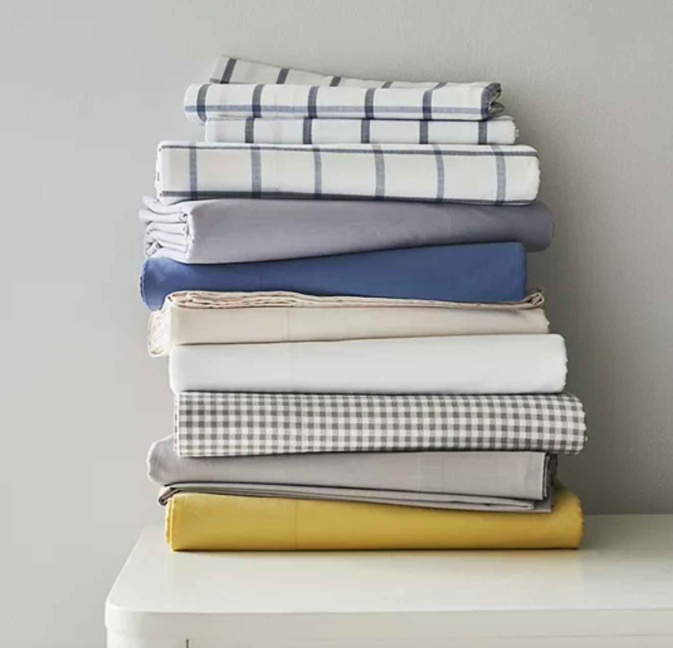 a stack of different colors sheet sets