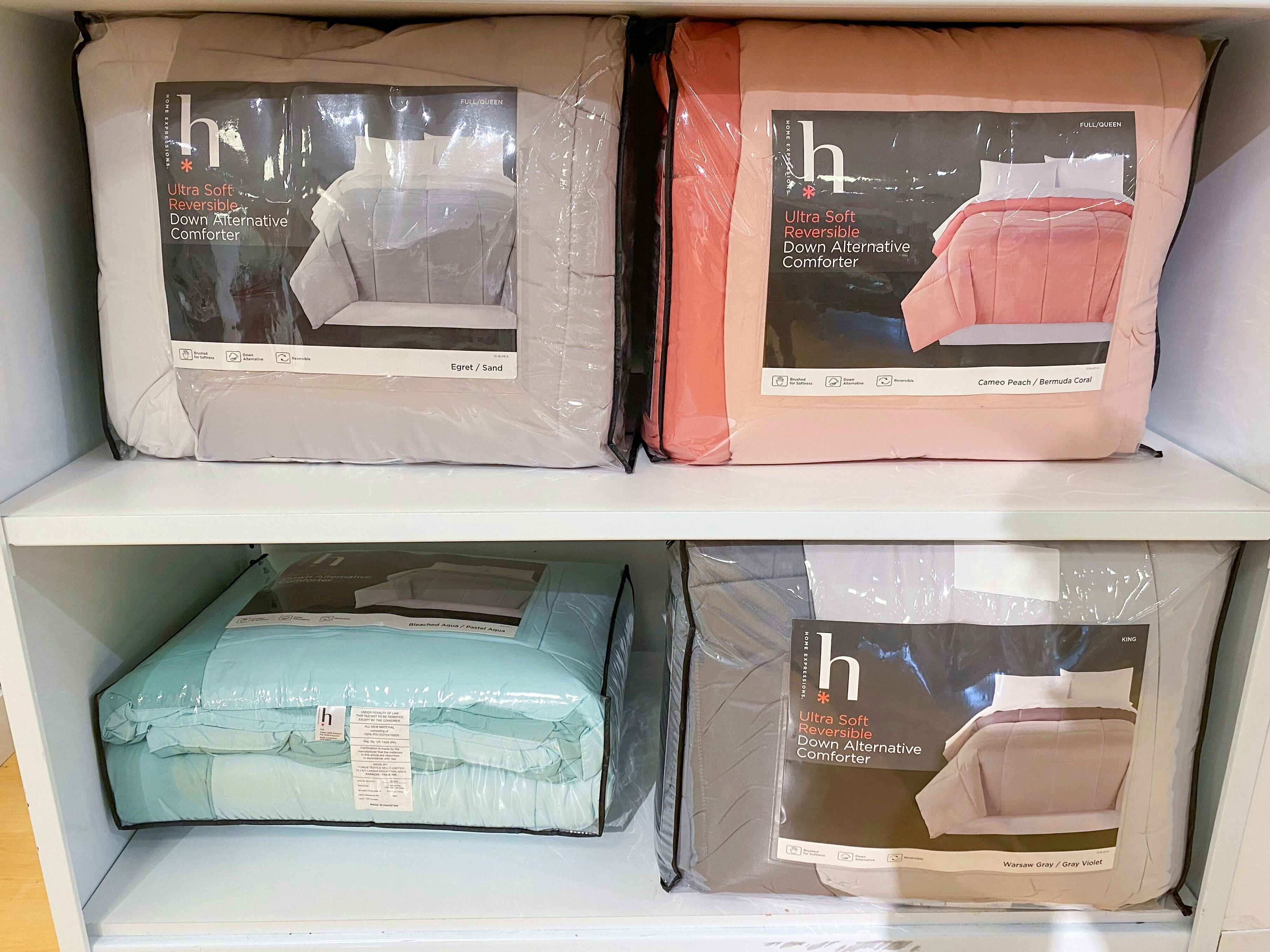 display of reversible down-alternative comforters