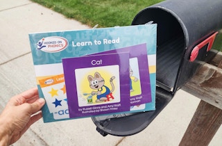 hooked on phonics materials held next to a mailbox