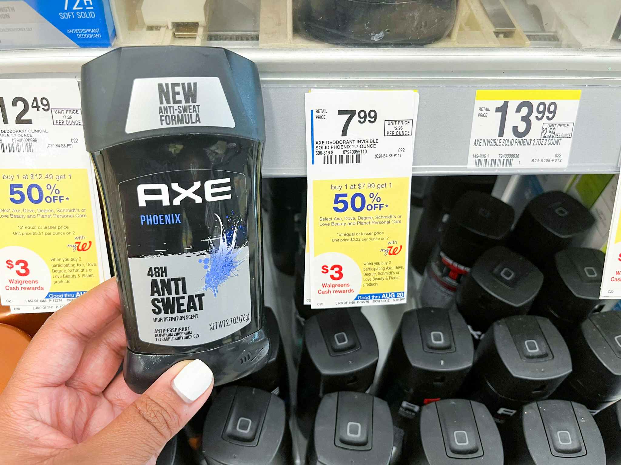 hand holding axe deodorant next to price tag