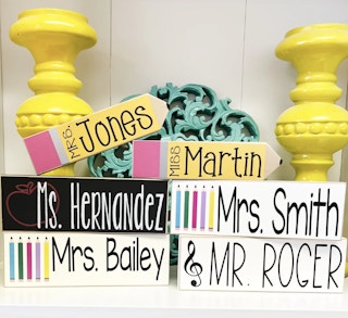 personalized teacher signs that look like number 2 pencils, books, apples, and music notes