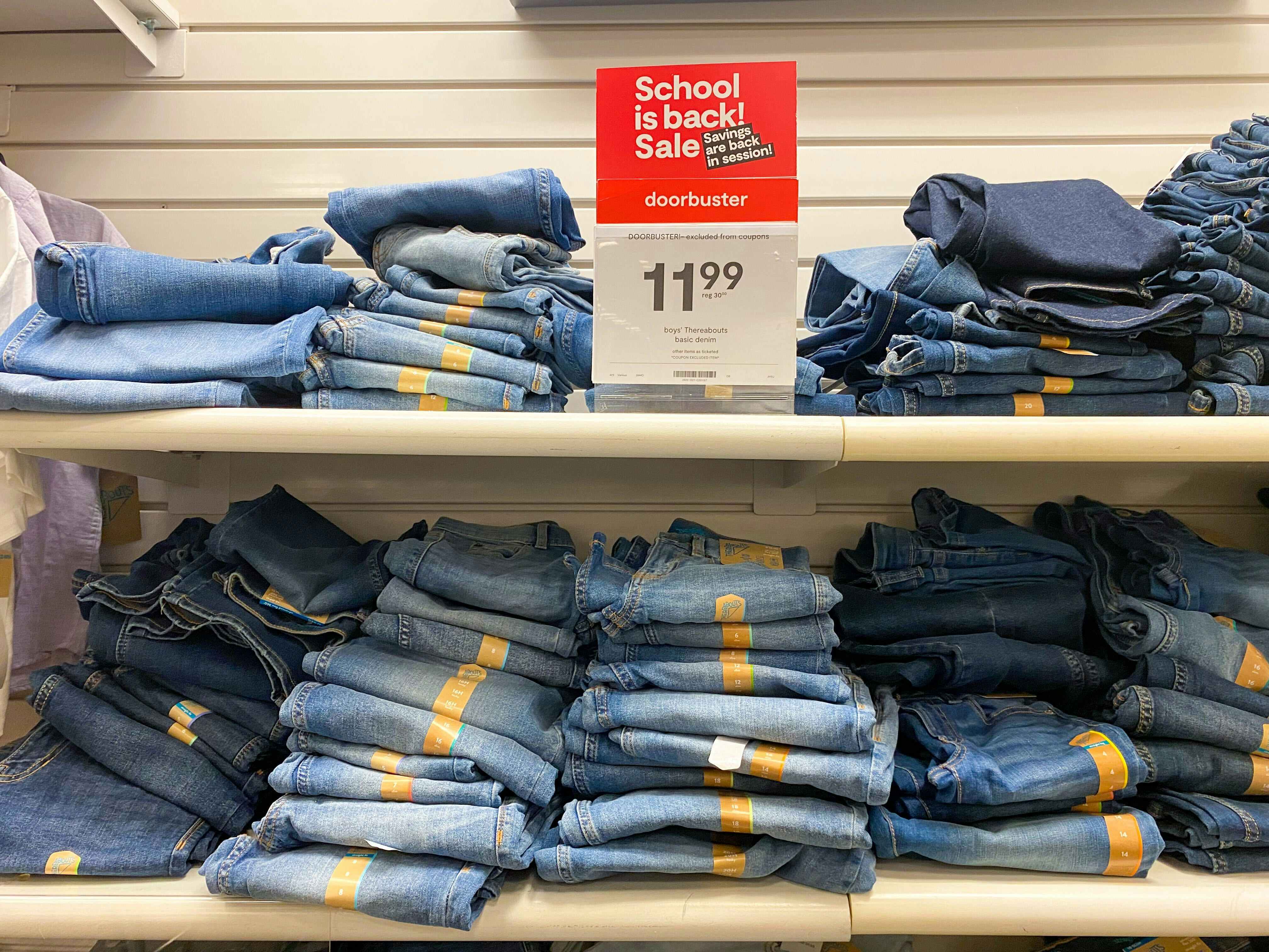 display of kids jeans on sale