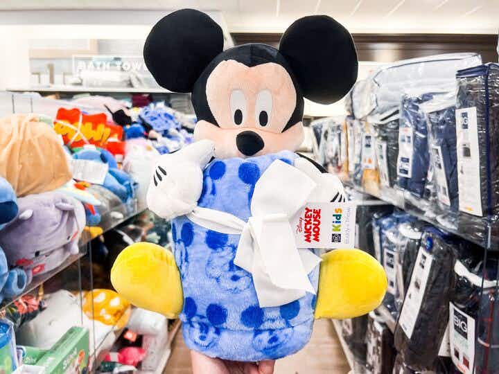 mickey mouse big one plush buddy set being held up in the aisle at kohls