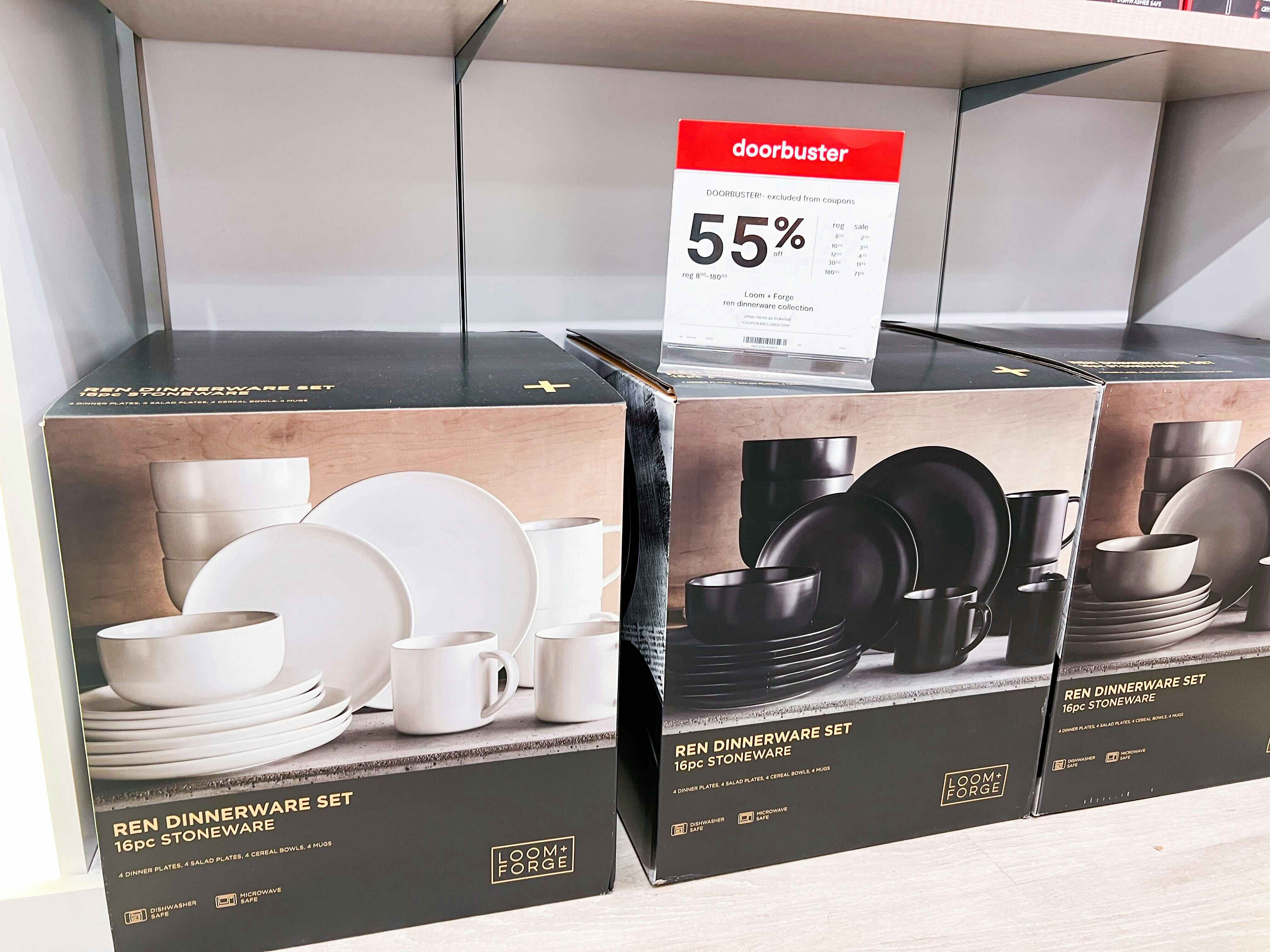 dinnerware sets in their box next to a 55% off sign