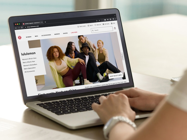 A person using their laptop to shop on the Lululemon online store.