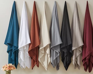 Stock image Egyptian cotton blanket hanging on the wall