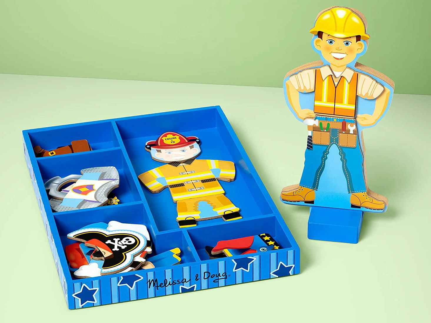 A Melissa & Doug Joey Magnetic Wooden Dress-Up Set on a table.