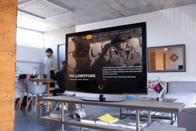 Television in a modern living room space showing paramount plus offering " Yellowstone