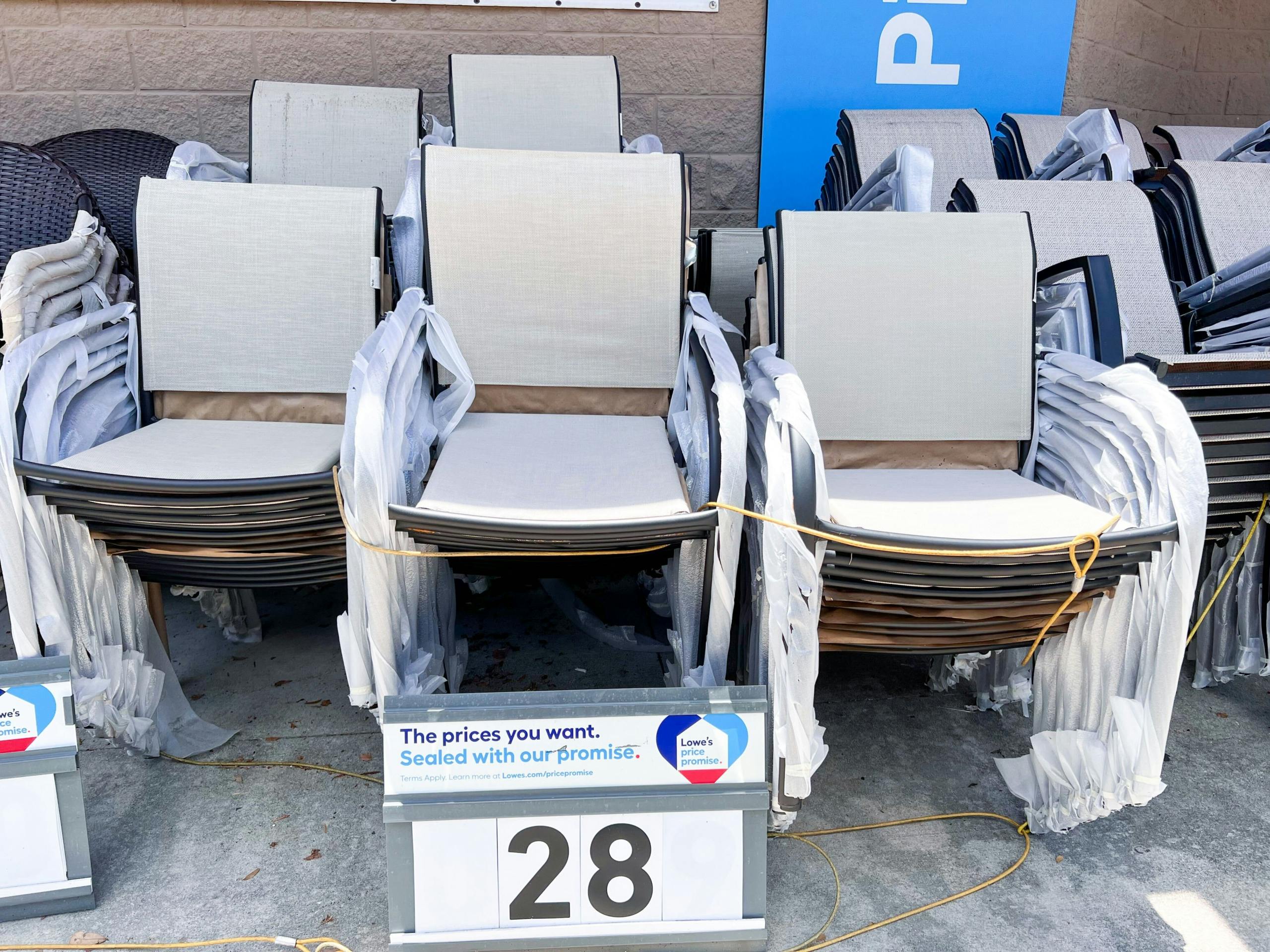 stacked chairs on sale outside of Lowe's