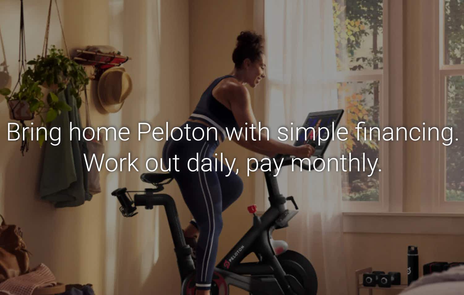 A graphic from Peloton with a woman on a Peloton bike that reads, "Bring home Peloton with simple financing. Work out daily, pay monthly.