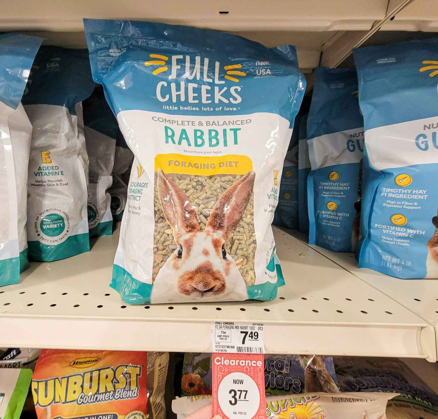 a bag of foraging diet full cheeks rabbit food on the shelf by clearance tag for $3.77