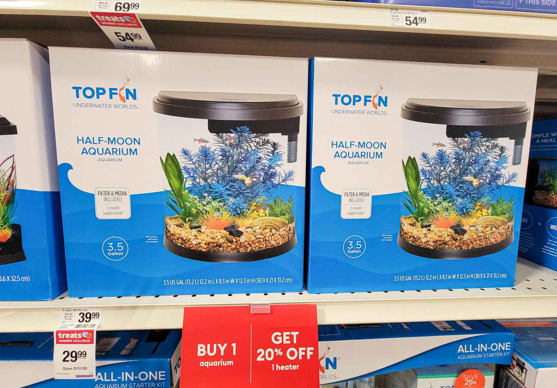 half moon aquariums in boxes on a shelf