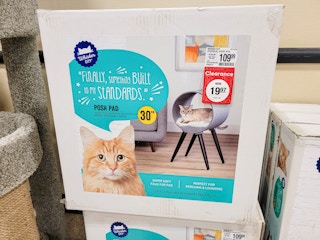 a round posh pad cat bed on a stand