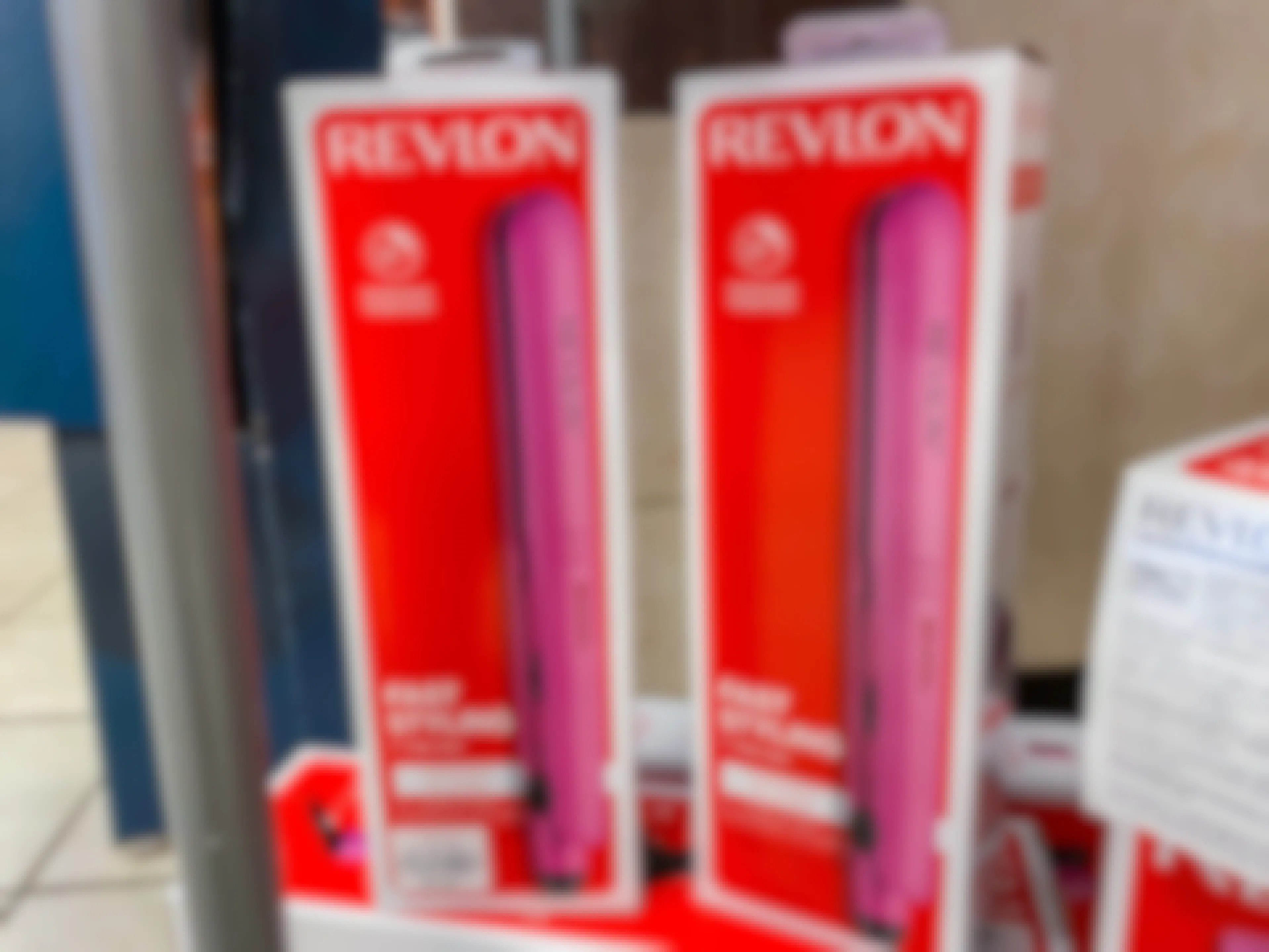 revlon flat irons next to each other in the box
